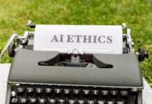 Stara maszyna do pisania na dworze z kartką z napisem AI ethics