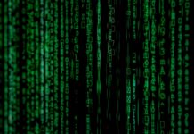 Zielone cyfry binarne na abstrakcyjnym tle przypominającym szyfr matrix